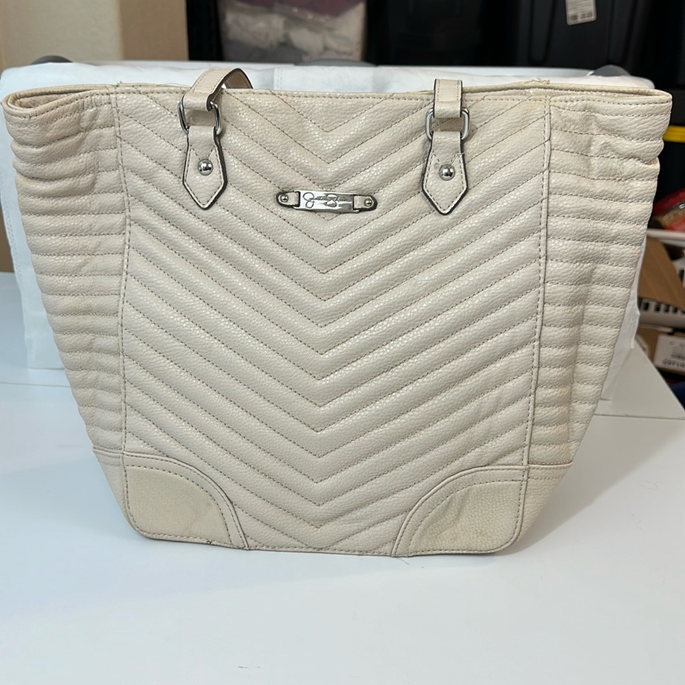 Jessica Simpson shoulder tote in cream. Minor markings shown in pictures.